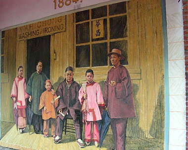 Mural depicting Wah Chong family outside their laundry business in Vancouver. By Arthur Cheng 2010. 1885 date