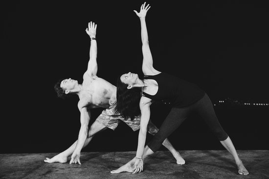 Eoin Finn and Insiya Raiswala-Finn practice yoga