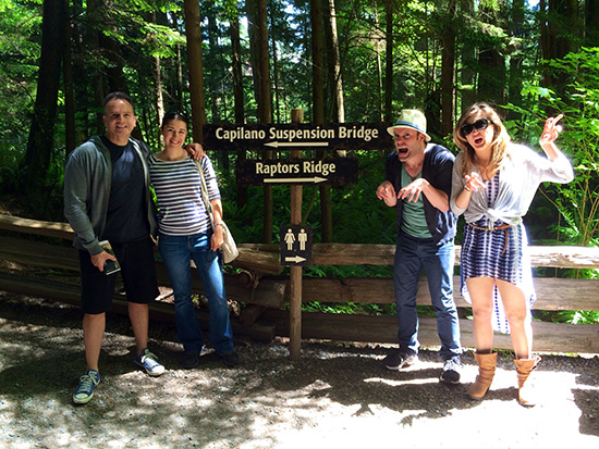 Company members taking on the heights of the Capilano Suspension Bridge