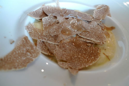 Shaved white Alba truffles from Italy top this risotto. | Wikimedia Commons, Arnold Gatilao photo.