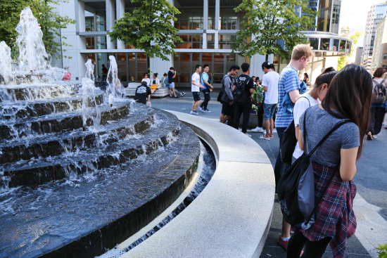 Pokémon Go players at the Waterfront Centre courtyard fountain.
