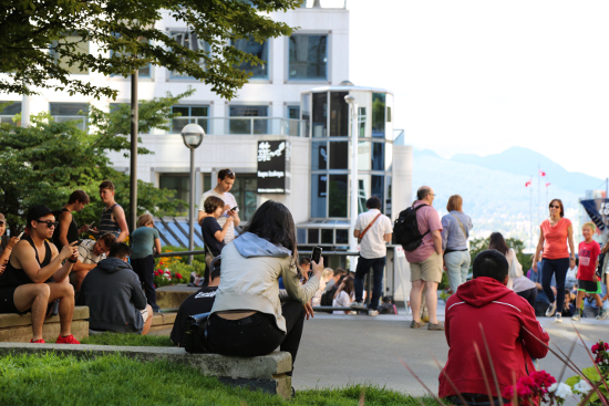 Pokemon Go fans gather between Pokemon Lure Stops at The Vancouver Club, the Jumping Jack art installation, and Waterfront Centre. 