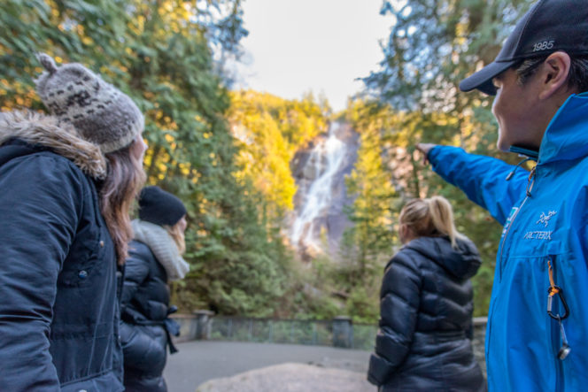 Tourists look at Shannon Falls in Squamish, BC