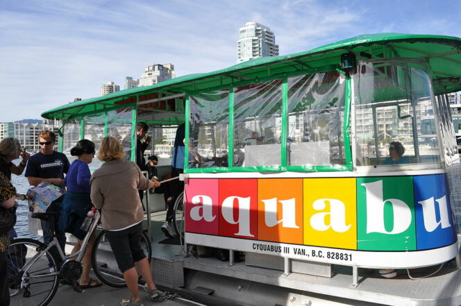 Cyclists loading bikes on to the Aquabus in Vancouver