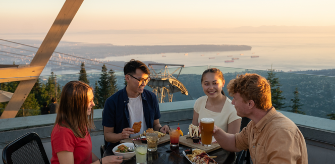 Diners enjoy food with a view of Vancouver at Altitudes Bistro on Grouse Mountain