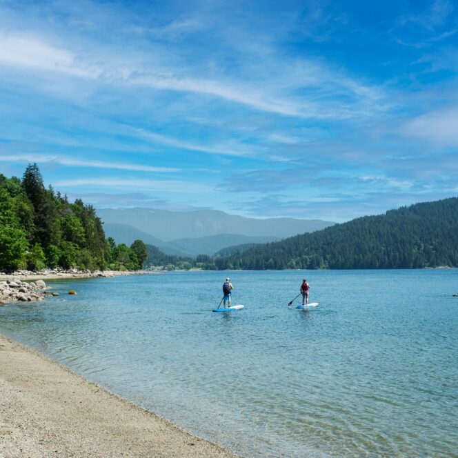 Two people padleboard at Cates Park in North Vancouver