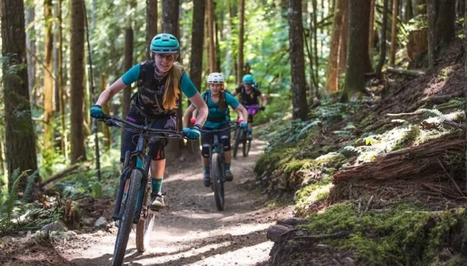 Three women mountain biking in Squamish