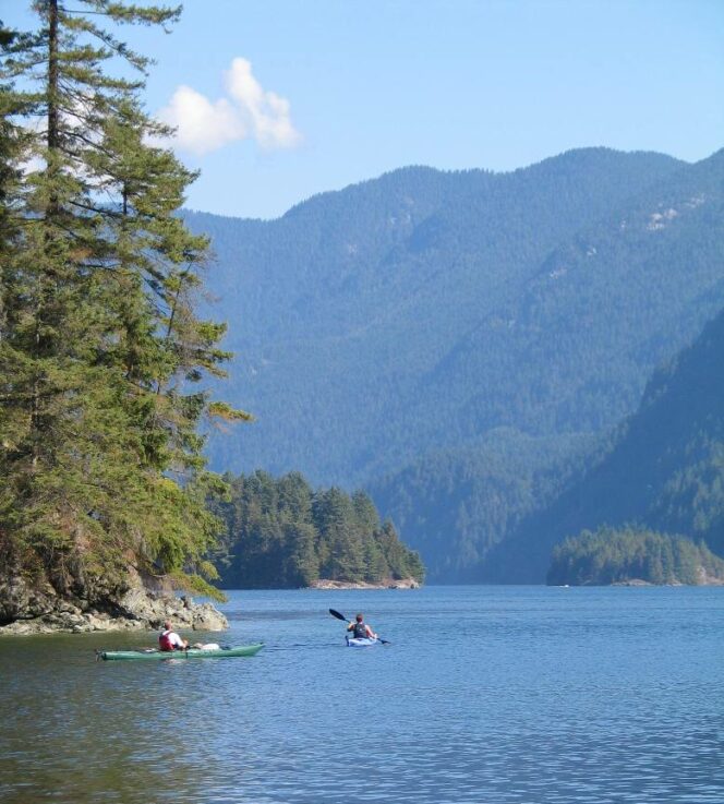 Kayakers at Jug Island Beach in Belcarra Regional Park. 