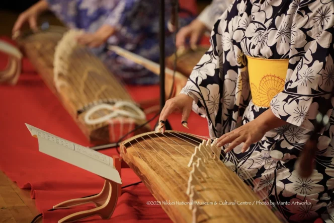 A person plays a traditional Japanese instrument at the Nikkei Matsuri in Burnaby. 