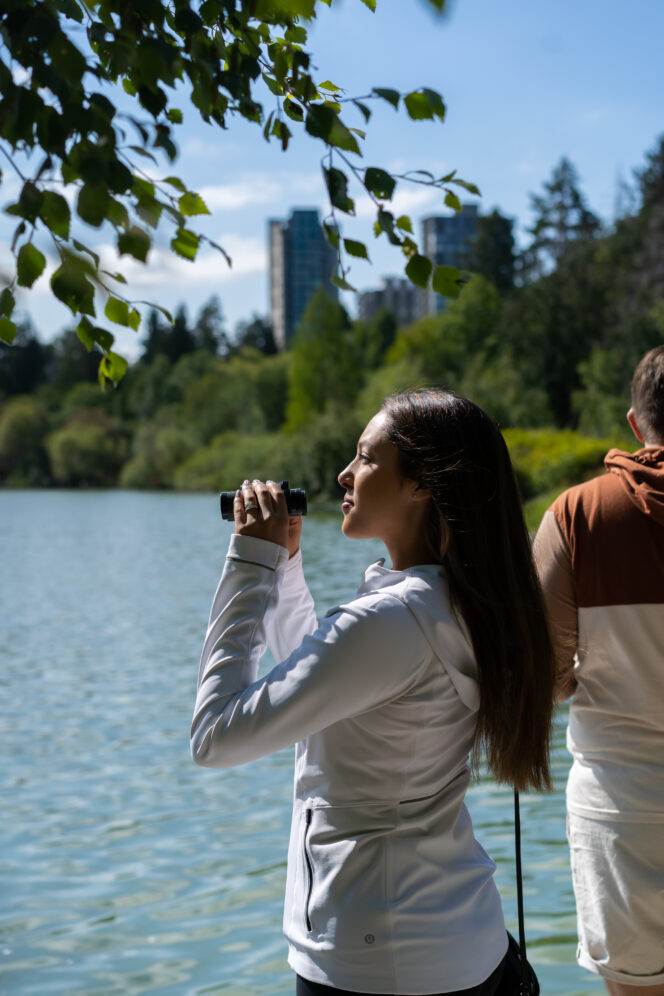 People bird watching at Lost Lagoon in Stanley Park