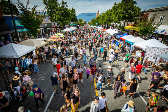 People and tents on the street at Main Street Car-Free Day in Vancouver.