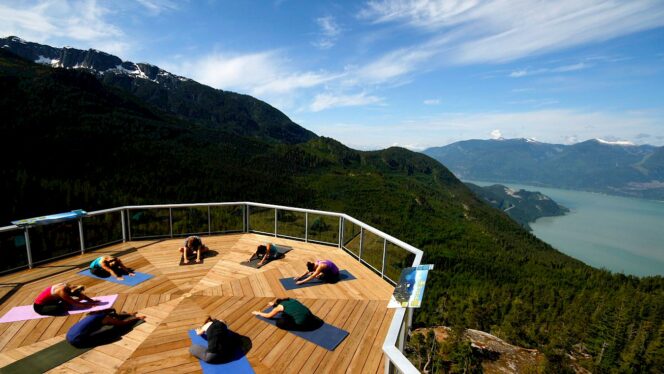 People do yoga on the deck at the Sea to Sky Gondola.