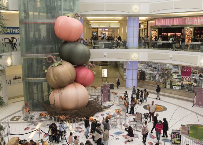 Giant pumpkins and other fall decor in the atrium at Metropolis at Metrotown.